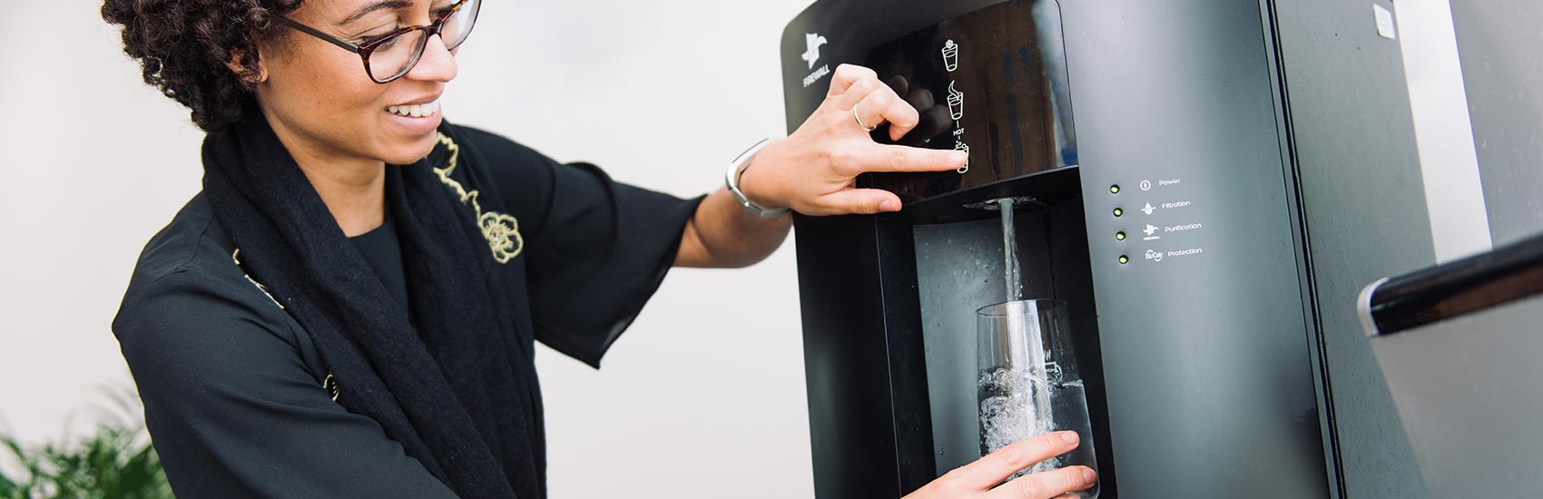 Woman using WL3 water dispenser